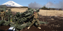 Lance Cpl. Austin J. Lapierre fires an M777 A2 155 mm howitzer Jan. 30 during Exercise Fire Dragon 13-2 in the East Fuji Maneuver Area. The live-fire portion of Fire Dragon provides Marines the opportunity to enhance their mission capabilities in artillery operations. Lapierre is a field artillery cannoneer with 1st Battalion, 12th Marine Regiment, 3rd Marine Division, III Marine Expeditionary Force. 