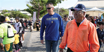 Mitsuo Gima and Col. John E. Kasperski participate the opening day of the annual Urasoe City tedako walk Feb. 2. The two-day event allowed participants to experience historic sites while promoting a healthy lifestyle. Gima is the mayor of Urasoe City, and Kasperski is the Camp Kinser commander and commanding officer of Combat Logistics Regiment 37, 3rd Marine Logistics Group, III Marine Expeditionary Force. 