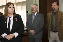 From right, Robert Griffith and Curtis J. Kozlesky listen as Patricia H. Dunbar speaks about the teamwork of herself and her peers after receiving the Meritorious Civilian Service Award Jan. 18 in Camp Foster’s building one headquarters. “I think a large factor in (receiving this award) is the camaraderie that we have above and beyond (our working relationship),” said Dunbar. “They have allowed me to be a part of this family, and learn and grow with them.” Dunbar received the award for her successes and dedication while working for Marine Corps Installations Pacific from January 2010 to November 2012. Dunbar is the chief management analyst in the management assistance office, G-1, personnel, administration and manpower. Griffith is a management analyst with the management assistance office, G-1, personnel, administration and manpower. Kozlesky is the assistant chief of staff for G-1, personnel, administration and manpower, Marine Corps Installations Pacific.