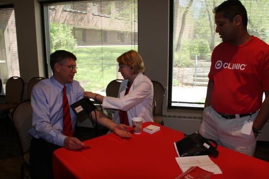 Rep. Paulsen gets his blood pressure checked during his Seniors Fair