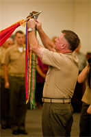 Lt. Gen. Terry G. Robling, commander of U.S. Marine Corps Forces, Pacific, attaches a Meritorious Unit Commendation streamer with a bronze star to the MarForPac colors here Feb. 1. Marines at MarForPac were awarded a MUC for spearheading the Corps’ rebalance toward Asia-Pacific from Sep. 1, 2010 to Aug. 31, 2012. 