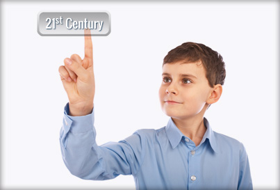 Photo of an older boy touching the words 21st Century floating in front of him