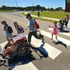 Melinda Thayer and Ashley Ovsijenko walk with their children to Irwin Intermediate School on Fort Bragg. Thayer says she can often get to school and back home faster than parents who drive.