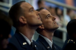 Brothers Tech. Sgt. Glenn and Master Sgt. Greg Coleman watch other military contestants participating on "Wheel of Fortune" on overhead monitors while waiting for their opportunity to compete on the show.