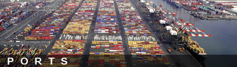 Photo of ship at dock with container cranes