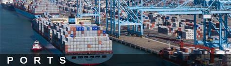 Photo of ship at dock with container cranes