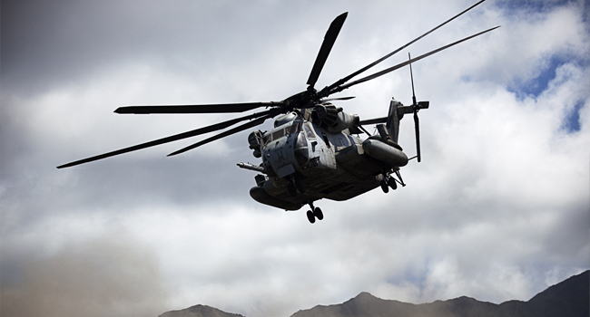 Two U.S. Marine Corps CH-53E Super Stallion helicopters assigned to Marine Heavy Helicopter Squadron (HMH) 463 take off after delivering Marines and Canadian soldiers as part of a noncombatant evacuation operation during exercise Rim of the Pacific (RIMPAC) 2012 at Marine Corps Training Area Bellows, Marine Corps Base Hawaii, Kaneohe Bay, Hawaii, July 26, 2012. RIMPAC is a U.S. Pacific Command-hosted biennial multinational maritime exercise designed to foster and sustain international cooperation and security on the world