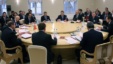 Then-Russian Prime Minister Vladimir Putin (third from right) chairs a Eurasian Customs Union meeting in 2009. 
