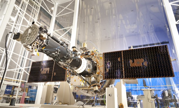 With its solar panels deployed, this is the spacecraft that will be used for NASA's Interface Region Imaging Spectrograph (IRIS) mission as seen in a clean room at the Lockheed Martin Space Systems Sunnyvale, Calif. The spacecraft is scheduled to be launched this April. (Photo: Lockheed Martin)