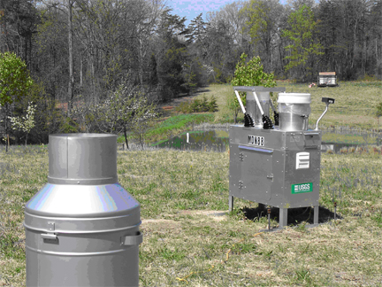 View of the VA-08 MDN site showing the recording rain gauge (foreground) and an MDN precipitation collector (background).