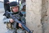 AL ANBAR PROVINCE, Iraq (October 5, 2006) - U.S. Army Spc. Jennie Baez provides security for fellow soldiers during an operation in the Al Anbar province of Iraq on Sept. 27, 2006. Baez is assigned to the 47th Force Support Battalion. Photo by Lance Cpl. Clifton D. Sams, U.S. Marine Corps.