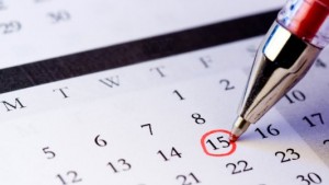 A red pen circling a date on a calendar.
