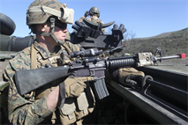 130213-M-ET630-014 
MARINE CORPS BASE CAMP PENDLETON, Calif. – Pfc. Mason Moore, a rifleman and Chillicothe Mo., native, with Bravo Company, 1st Battalion, 4th Marine Regiment, 13th Marine Expeditionary Unit, provides security in an amphibious assault vehicle 7 during Exercise Iron Fist 2013, aboard Marine Corps Base Camp Pendleton, Calif., Feb. 13, 2013. During Exercise Iron Fist 2013, the 13th MEU and Japan Ground Self Defense Force spent three weeks participating in bilateral training which improved their interoperability, enhanced military-to-military relations, and sharpened skills essential to crisis response. (U.S. Marine Corps photo by Lance Cpl. Demetrius Morgan/released)
