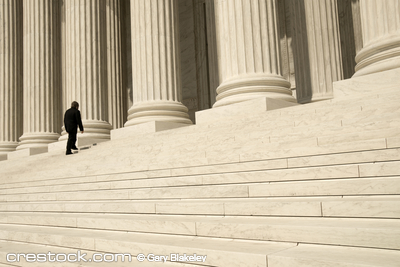 A man ascending the steps at the entrance to t...