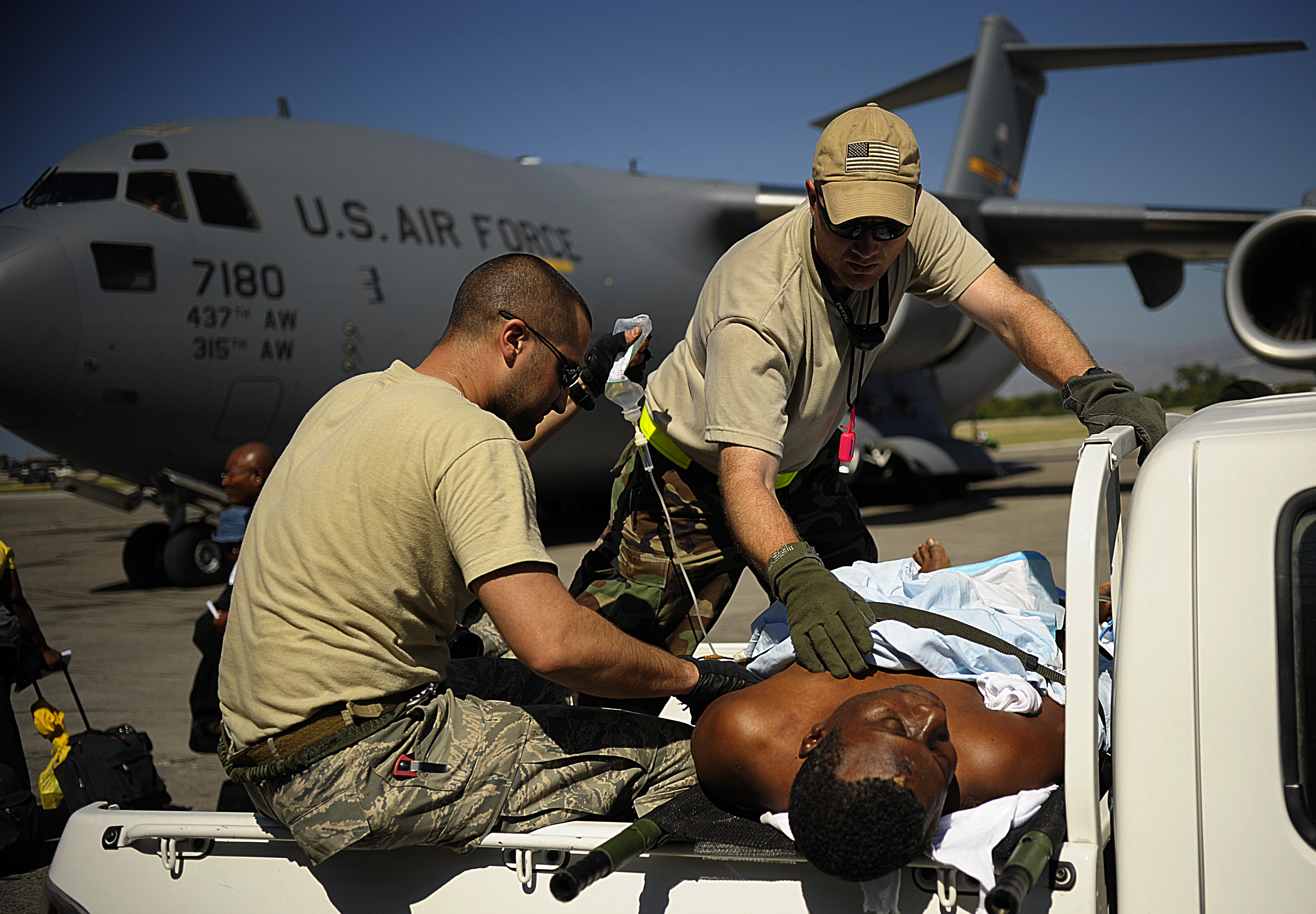 USAF medics care for injured Haitian