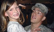 Then-Army Staff Sgt. Clinton L. Romesha greets his oldest child, Dessi, during his homecoming from Iraq. Romesha Family courtesy photo