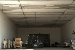 Aerial porters assigned to the Heavy Airlift Wing work alongside their Hungarian air force counterparts to build pallets for an upcoming resupply mission to Afghanistan.