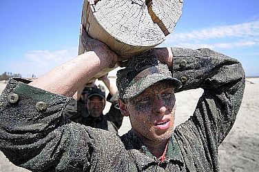 First Phase Basic Underwater Demolition/SEALs (BUD/S) candidates participate in log physical training during at Naval Amphibious Base Coronado. The Navy SEALs are the maritime component of U.S. Special Operations Forces and are trained to conduct a variety of operations from the Sea, Air and Land.  U.S. Navy photo by Mass Communication Specialist 2nd Class Kyle D. Gahlau (Released)  110411-N-JR159-138