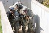 Soldiers of Co. A, 2nd Bn., 34th Armor Regt., advance down a narrow trench together during a trench-clearing training event Oct. 10 at Fort Riley. Sixty Soldiers from the company were at the Trench and Mine Facility to develop as a team and gain confidence in a simulated tactical environment.  Photo by: 2nd Lt. Daniel Kelly, 1ST ABCT.