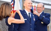 Col. James Eifert (center) is promoted to the rank of brigadier general and officially "pinned" by his wife Beth and the Adjutant General of Florida Maj. Gen. Emmett Titshaw Jr. during a ceremony in St. Augustine, Fla., Feb. 8, 2013. Concurrently Eifert assumed the position of Assistant Adjutant General for Air and Deputy Commander of the Florida Air National Guard. Photo by Master Sgt. Thomas Kielbasa