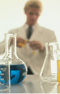 Chemist measuring liquids