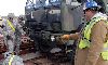 Phil Melton, with the locomotive crew at Fort Riley’s railhead, far right, provides guidance to Soldiers with the 2nd ABCT, as they attempt to tie down a vehicle on a railcar during a Nov. 15 class at Camp Funston. Soldiers gained valuable skills that will aid the brigade as it prepares to move equipment and vehicles to NTC early next year.  Photo by: Sgt. Daniel Stoutamire, 2ND ABCT.