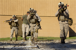 Marines of Company K, Battalion Landing Team (BLT) 3/2, currently reinforcing the 26th Marine Expeditionary Unit (MEU), egress from the objective during the mechanized raid course
 at Camp Lejeune, N.C., Oct. 10, 2012. BLT 3/2 is one of the three reinforcements of 26th MEU, which is slated to deploy in 2013.