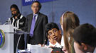 Students competing in the Science Bowl with Michelle Obama and Dr. Chu in the background