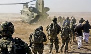 U.S. soldiers and sailors assigned to Provincial Reconstruction Team Farah are joined by leadership from the Farah province directorate of agriculture, irrigation and livestock as they file onto a CH-47 Chinook helicopter after a key leader engagement in Lash-e Juwayn, Afghanistan, Jan. 24, 2013. PRT Farah team members met with key leaders in to discuss an ongoing irrigation project. U.S. Navy photo by Chief Petty Officer Josh Ives