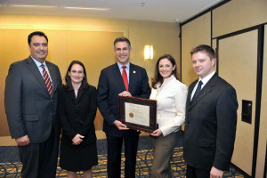 Under Secretary for International Trade Francisco Sánchez (center) presents MDCP award at the Americas Competitiveness Forum in Atlanta on November 14.