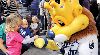 A young fan gets a “pound” from Sluggerrr, mascot for the Kansas City Royals, Jan. 22.  Photo by: Amanda Kim Stairrett, 1ST INF. DIV.