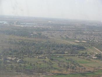 While traveling by helicopter, Congressman Murphy views the Iraqi landscape.