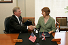 CBP Commissioner W. Ralph Basham and United Kingdom Chief Executive Lin Homer sign a bilateral agreement for a pilot program to facilitate travel between the U.S. and the U.K.