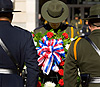 A Border Patrol agent lays a wreath at a memorial service honoring fallen agents and officers of CBP.