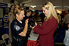 U.S. Customs and Border Protection officer holds puppy at the Public Service Recognition Week (PSRW).