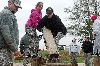 Jacki Lazinek, center left, and Tricia Evans, center right, both spouses of Soldiers with the 1st Sqdn., 4th Cav. Regt., stretch to place a wooden plank from one peg to another Oct. 25 at the Leader Reaction Course, one of the events spouses participated  in during the Raider Battalion’s Spouse Spur Ride.  Photo by: Sgt. Scott Lamberson, 4TH IBCT.