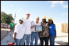 [Photo: 5 people in hard hats holding award]