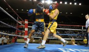 Photo: U.S. Naval Academy Midshipman 4th Class Mario Kohn, left, connects with a punch during the 147 lb. weight class bout of the annual Plebe Boxing Smoker held in Alumni Hall in Annapolis, Md August 4, 2012. Every plebe receives an introduction to boxing during plebe summer training. Plebe summer is a physically and mentally demanding six-week process designed to transition the new class of students from civilian to midshipman life. U.S. Navy photo by Mass Communication Specialist 1st Class Chad Runge