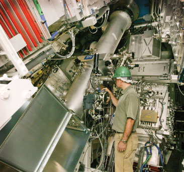 Photos of a techncian inspecting the Dante diagnostic device.