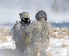 Command Sgt. Maj. Stephen Helton, TF Saber and 1st Sqdn., 6th Cav. Regt., gets prepared for extraction by a MEDEVAC crew chief assigned to TF Saber during HAMETS Dec. 11 at Fort Carson, Colo.  Photo by: 1st Sgt. Beck, CAB.