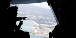 Lt. Gen. Kenneth J. Glueck Jr., silhouetted on the left, discusses Marine Corps installations throughout Okinawa Jan. 29 with Republic of Korea Marine Corps distinguished visitors aboard an MV-22B Osprey. Glueck also discussed the strong relationship between the two nations’ Marine Corps and emphasized the importance of bilateral training between the U.S. and ROK. Glueck is the commanding general of III Marine Expeditionary Force. 