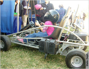 Girl sitting in go-cart (State Dept./David Parkes)