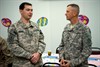 CAMP ARIFJAN, Kuwait (April 25, 2011) – Command Sgt. Maj. John D. Fourhman (right), who serves as the Third Army command sergeant major, speaks with retired Sgt. Tom Bishop, a native of Phoenix, Ariz., during a dinner honoring Wounded Warriors at Camp Arifjan, Kuwait, April 25.  The dinner was the first stop for the Wounded Warriors during Operation Proper Exit. Operation Proper Exit is sponsored by the United Services Organization allowing wounded Troops and Veterans to retrace the last steps they took before being injured. Bishop, who served with the 2nd Battalion, 82nd Field Artillery, 1st Calvary Division, suffered injuries in Iraq during Operation Iraqi Freedom in 2006. Photo by Sgt. Ryan Hohman, Third Army Public Affairs. VIRIN: 110424-A-1139H-024