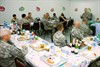 CAMP ARIFJAN, Kuwait (April 25, 2011) – Maj. Gen. Peter M. Vangjel (right), who serves as the Third Army deputy commanding general, speaks with Wounded Warriors during a dinner honoring Wounded Warriors at Camp Arifjan, Kuwait, April 25.  The dinner was the first stop for the Wounded Warriors during Operation Proper Exit. Operation Proper Exit is sponsored by the United Services Organization allowing wounded Troops and Veterans to retrace the last steps they took before being injured. Photo by Sgt. Ryan Hohman, Third Army Public Affairs. VIRIN: 110424-A-1139H-071