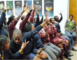 Students at the Mae Jemison Science Reading Room get their questions ready