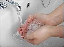 Cupped Hands Under Running Water