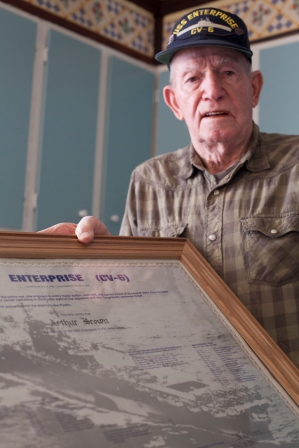 Arthur Brown, of Brown County, Ind., sits at his kitchen table, recounting his experiences aboard the USS Enterprise during World War II, Jan. 24. The Big E earned 20 of 21 Battle Stars for action in the Pacific during the war. (photo by Staff Sgt. David Bruce, Atterbury-Muscatatuck Public Affairs)