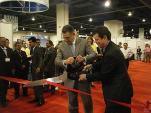 Francisco Sánchez, under secretary for international trade (left), and Chris DeMoulin, executive vice president of Advanstar Fashion Group and president of MAGIC International (right), cut the ribbon that officially opened the Sourcing at MAGIC show on August 22, 2011, in Las Vegas, Nevada. (photo courtesy U.S. Association of Importers of Textiles and Apparel)