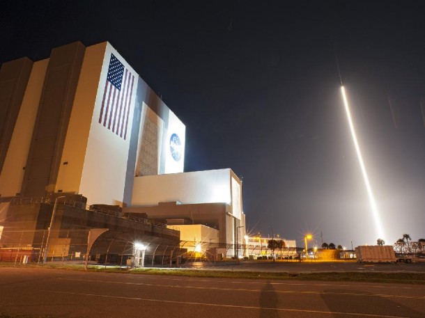 An Atlas V rocket carrying NASA's Tracking and Data Relay Satellite-K (TDRS-K), streaks past the Vehicle Assembly Building and Launch Complex 39 at Kennedy Space Center in Florida  (Photo: NASA)