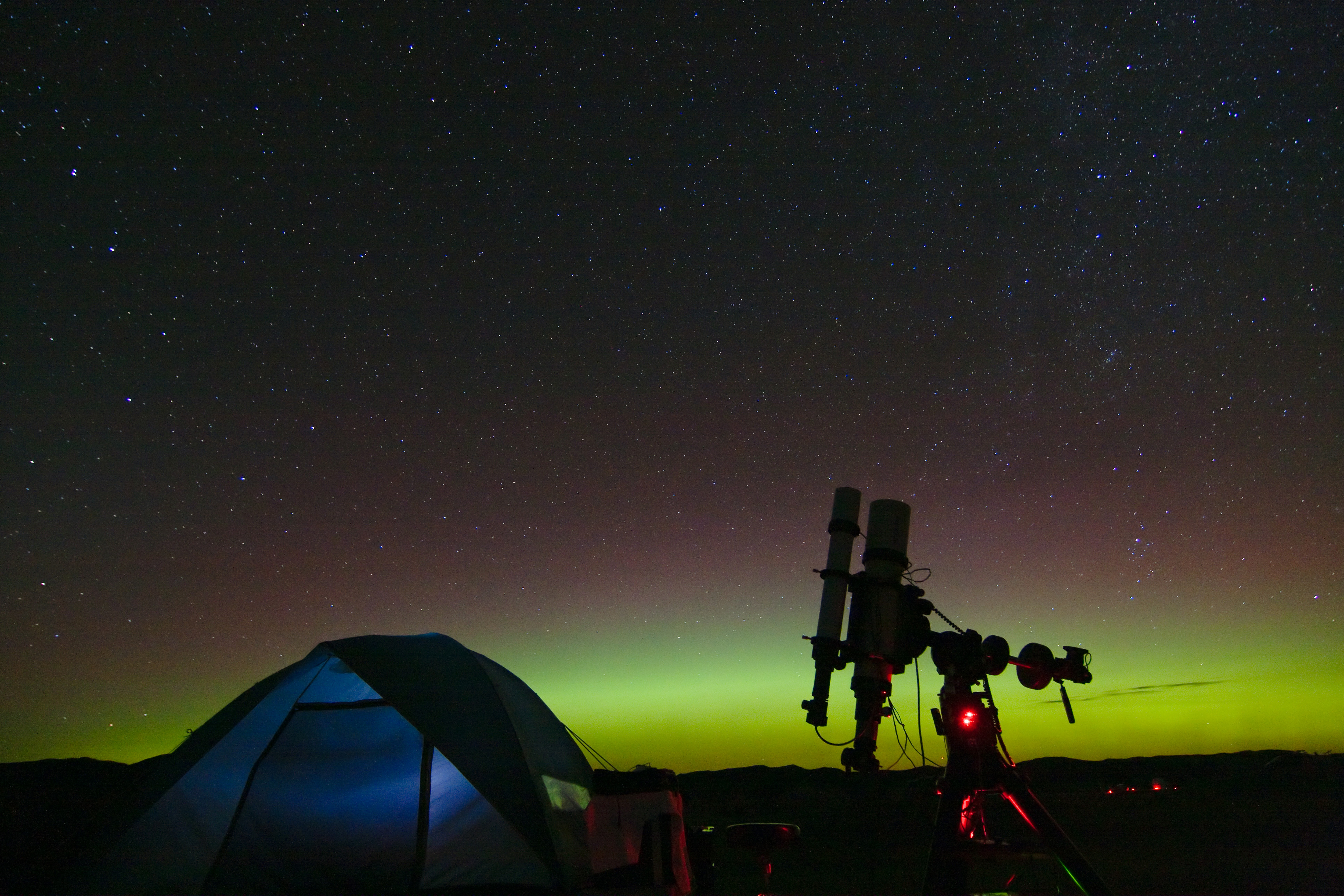 An aurora borealis visible in the northern sky over Merritt Reservoir in Valentine, Neb. (Photo: Howard Edin/Courtesy: National Science Foundation)